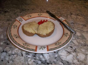 Potato cooked in the microwave using the Norpro potato feet holder.