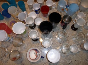 This is an aerial view of most of our cups sitting on the cabinet.