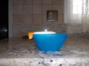 Joie egg separator fits the small blue bowl but easily slips off.