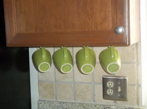 These green mugs add a nice splash of color to the kitchen.