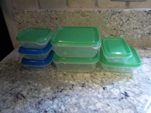 Our old clear ikea storage containers with green and blue tops.