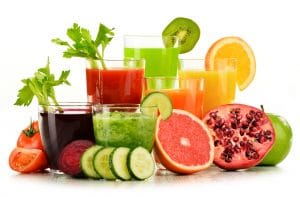 Glasses with fresh organic vegetable and fruit juices.