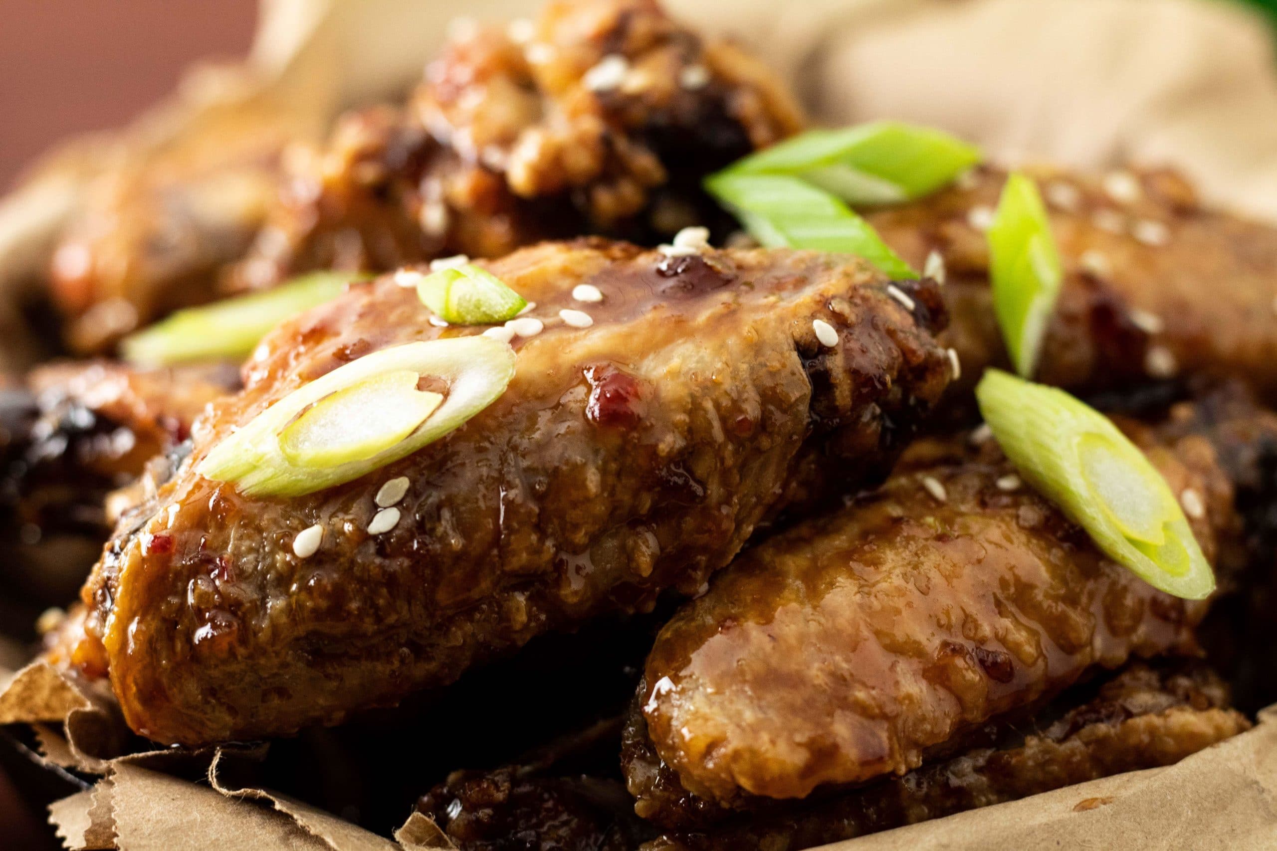 https://yourbetterkitchen.com/wp-content/uploads/2018/12/Asian-sticky-baked-crispy-sweet-and-spicy-wings-up-close.jpg