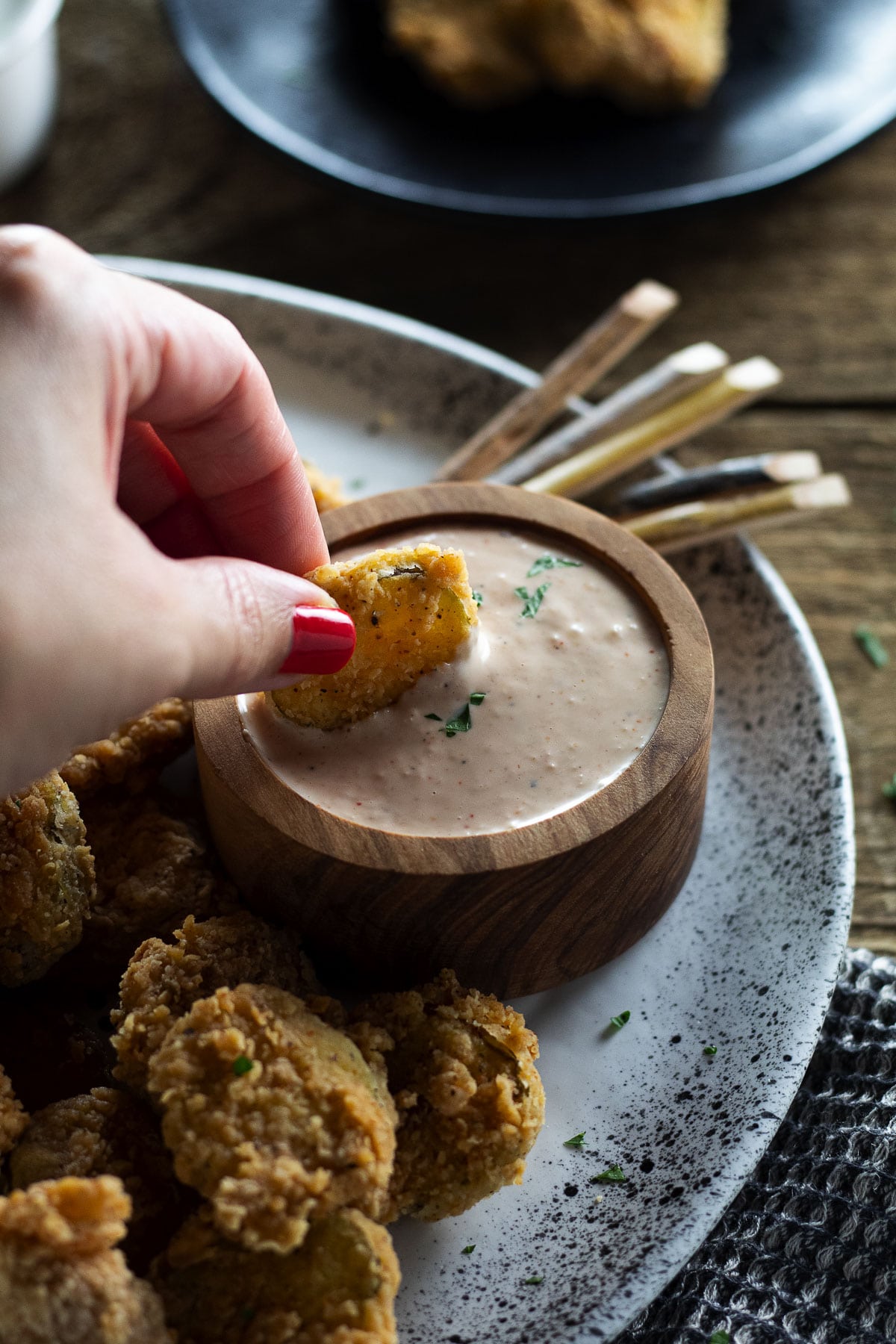 Dip shot of our better than Texas Roadhouse fried pickles recipe.