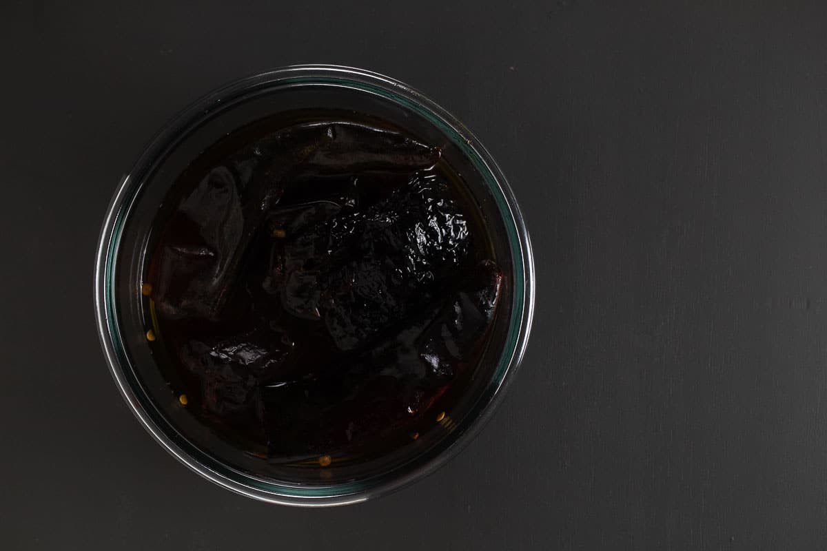 This image shows the peppers soaking in hot water.