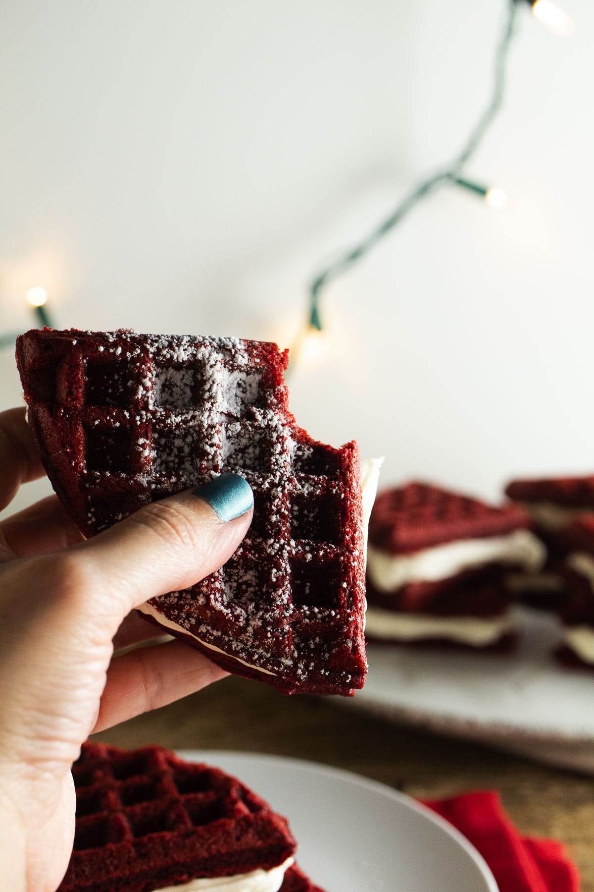 This is a bite image of our red velvet waffle whoopie pies.