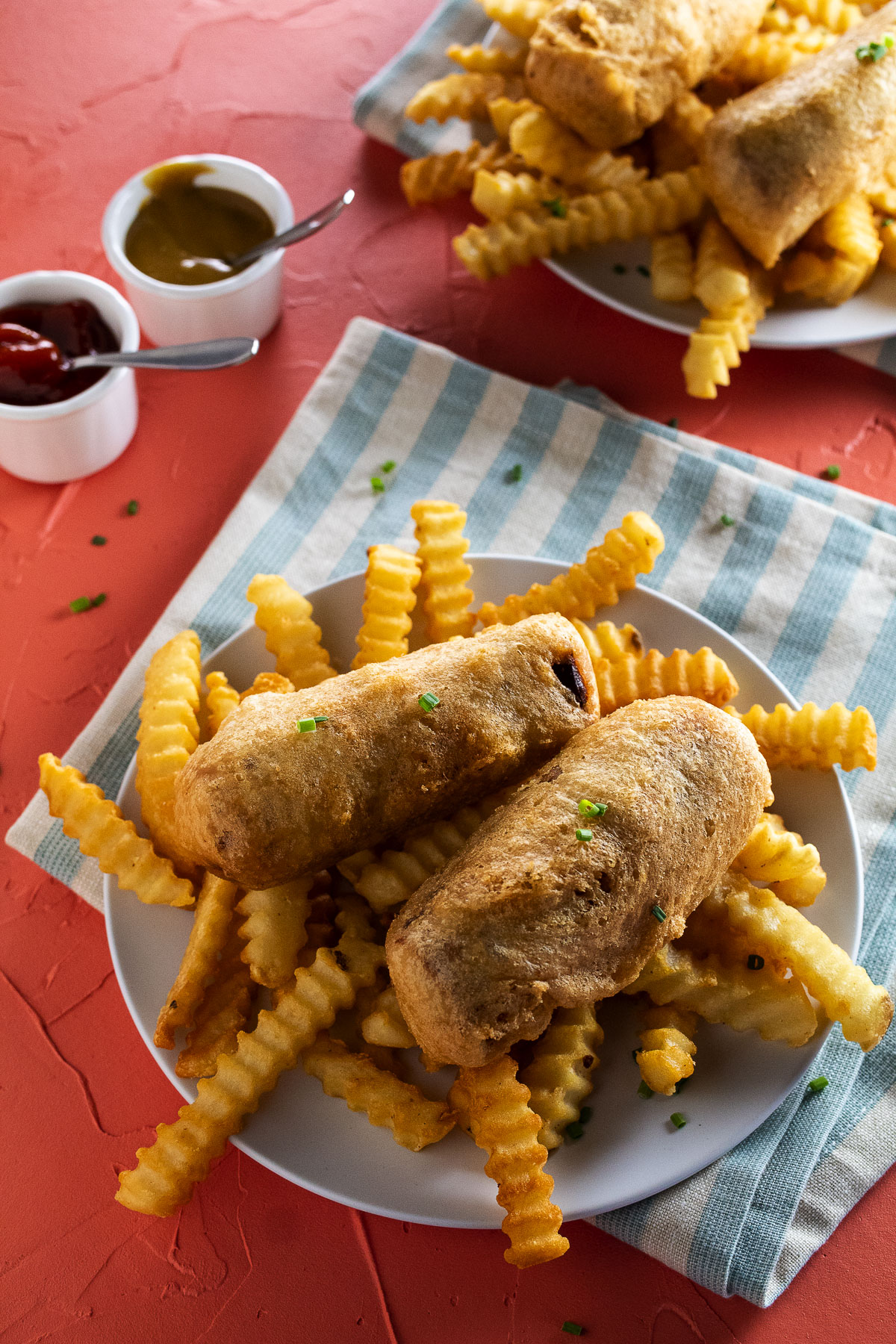 This is an image of battered sausage on a plate.