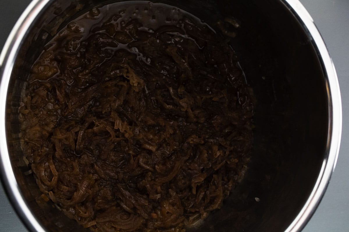 Caramelized onions in pot after 9 hours in slow cooker.