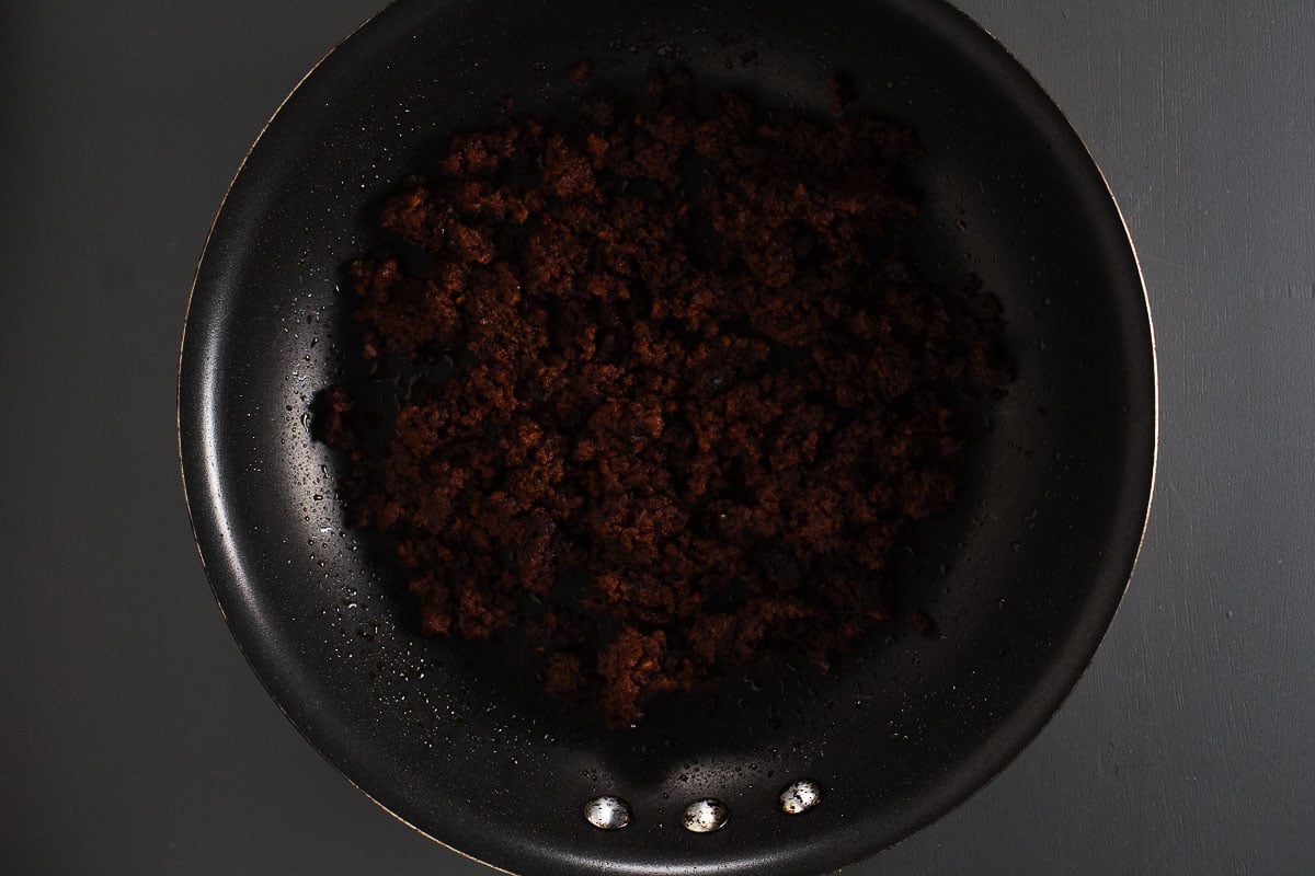 This is an image of cooked chorizo in the pan for the elotes fries.