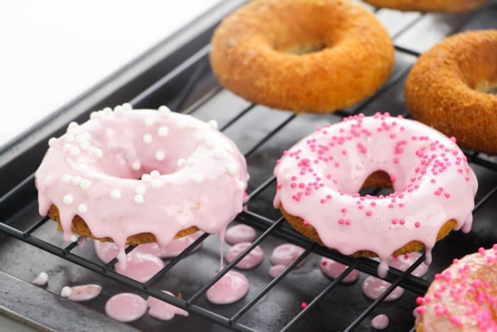 Easy strawberry frosted donuts recipe from Simple Sweet Recipes.