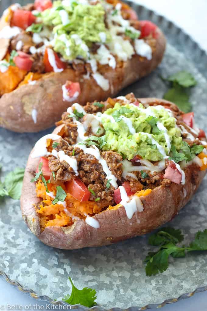 This is an image of taco stuffed sweet potatoes from The Belle of The Kitchen.