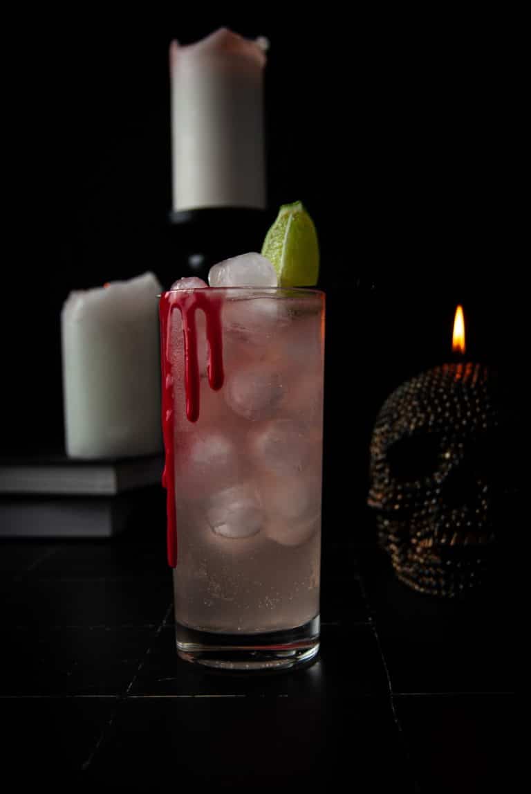 The "Dark & Spooky" alcoholic beverage with fake edible blood running down the sides with dark and spooky background.