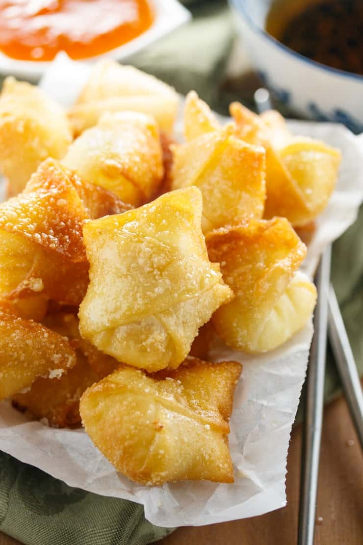 Fried sweet cream cheese wontons in a serving dish.