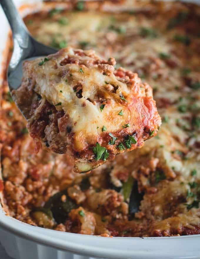 Zucchini lasagna slice on spatula.