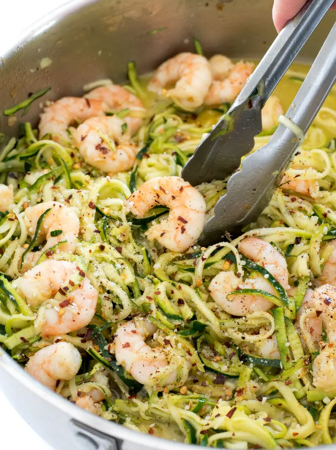 Shrimp scampi with zucchini noodles in a pot.