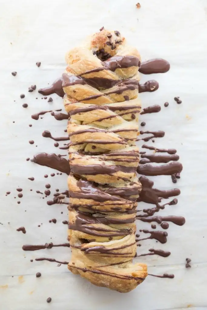 Chocolate cream cheese puff pastry on parchment paper.