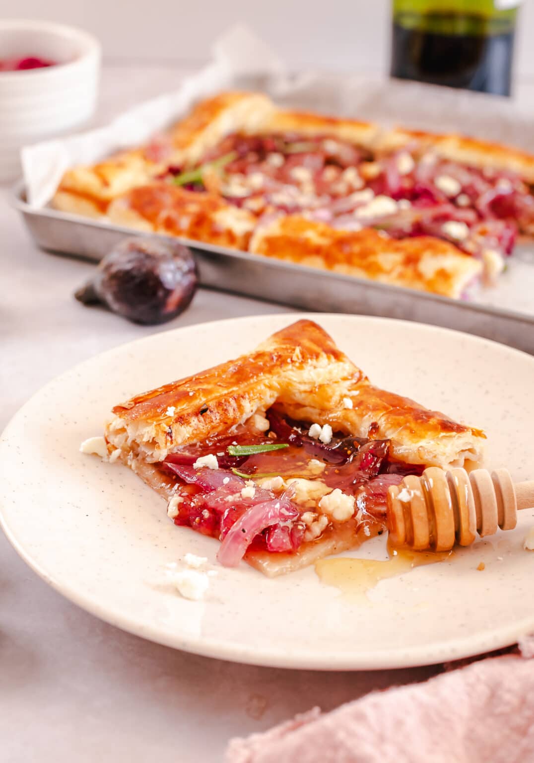 Caramelized onion tart on plate.