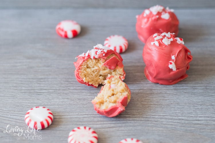 Pink cake pops with crushed peppermint on top.