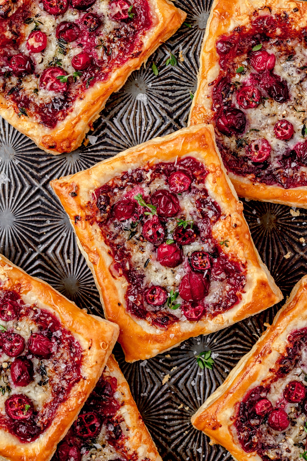 Cranberry puff pastries on silver tray.