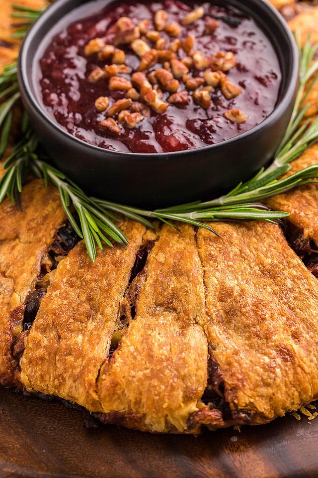 Pineapple cranberry brie crescent ring with dipping sauce.