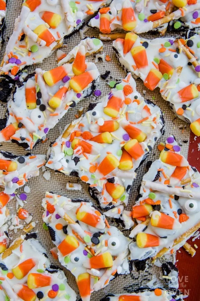 Candy corn bark with multicolored candy pieces and sprinkles.