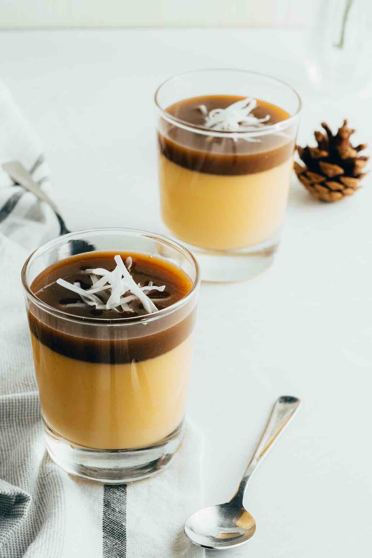 Pumpkin spice panna cotta with caramel layer and coconut on top.