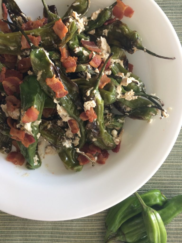 Peppers with cream cheese and bacon in a bowl.