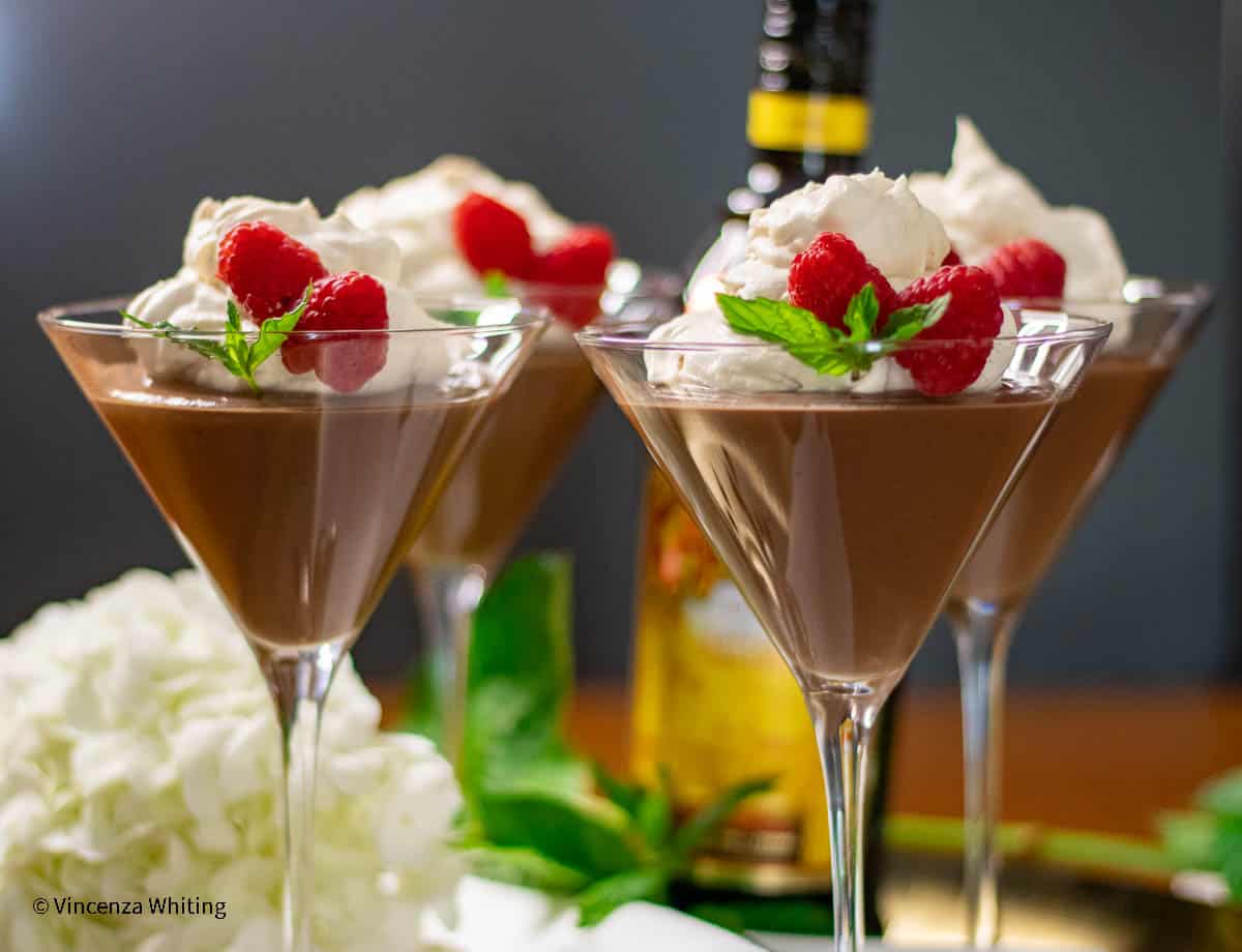 Chocolate budino with Kahlua mascarpone cream in elegant glasses.