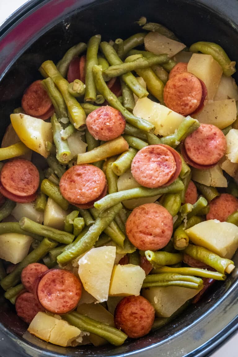 Kielbasa, green bean, and potato meal in crockpot.