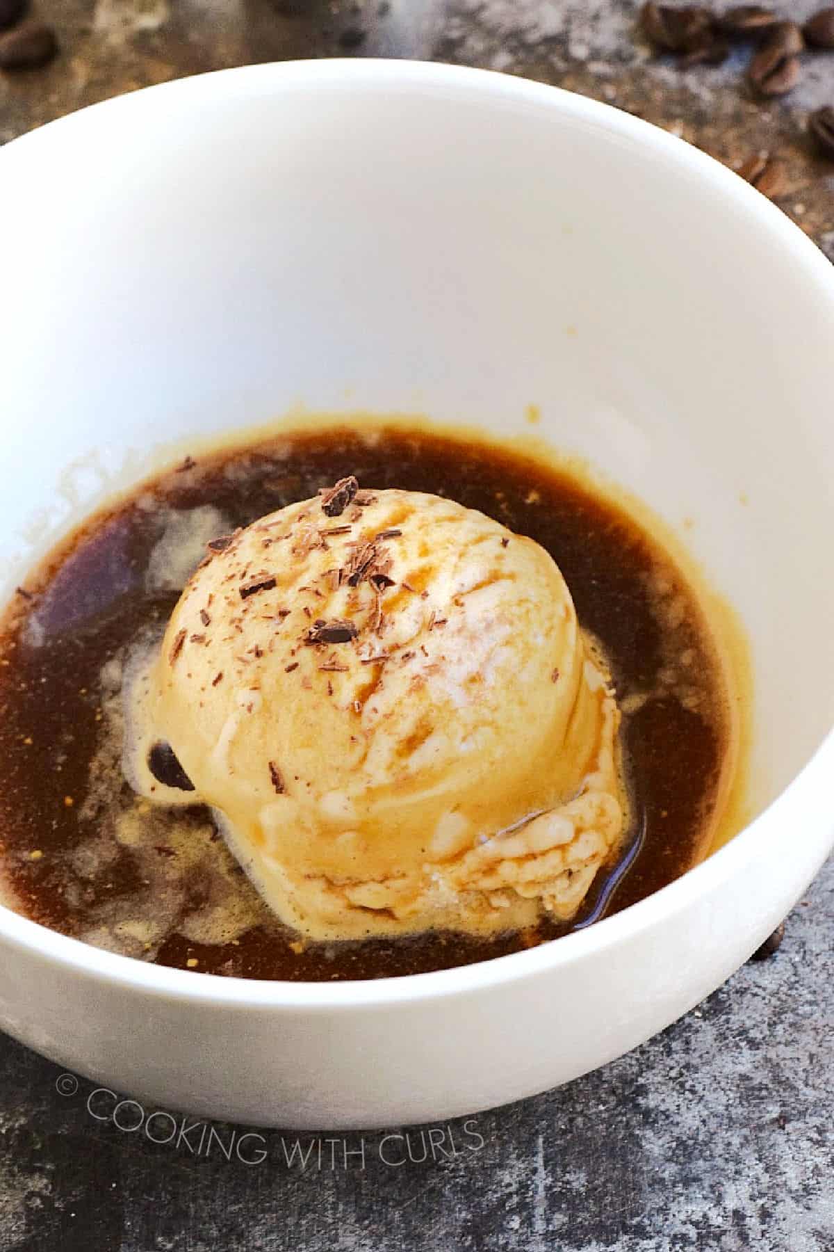 Affogato, ice cream or gelato, served with espresso in a bowl.