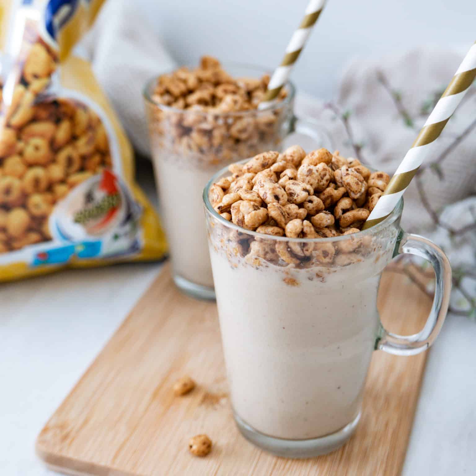 Jolly pong crush milkshakes in glasses with straws.