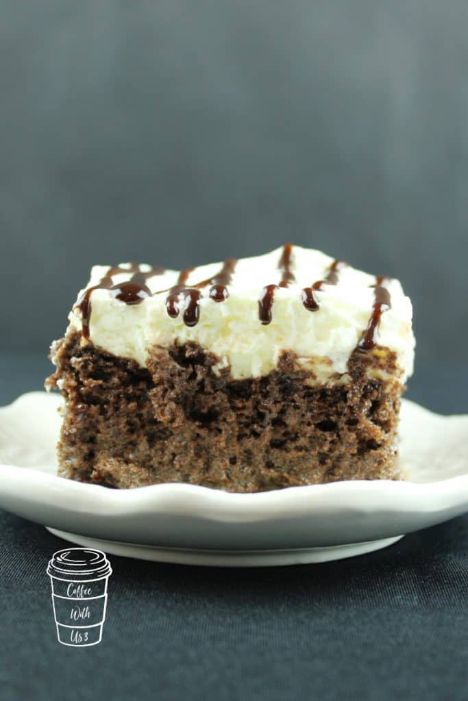 Mocha tres leches cake on a white saucer.