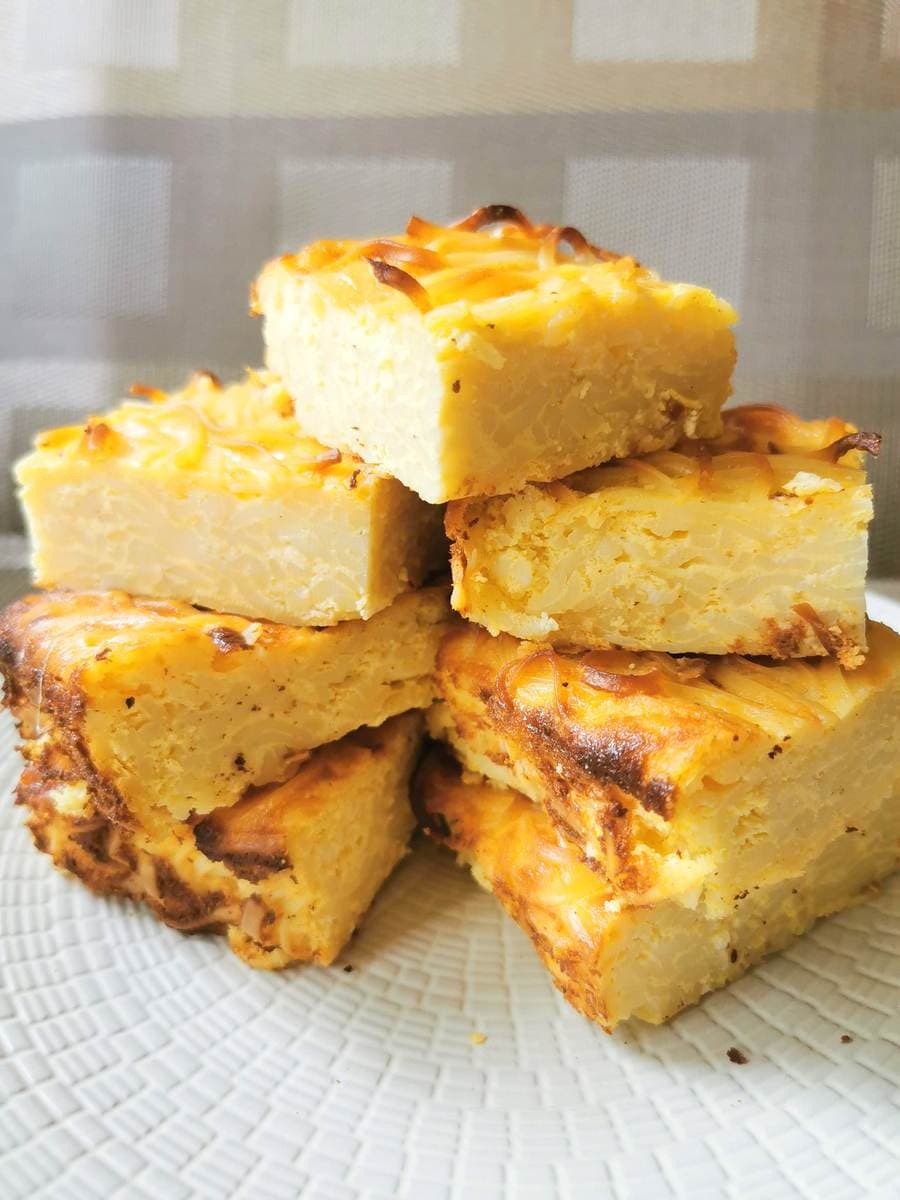 Neapolitan ricotta and pasta pie stacked on a plate.