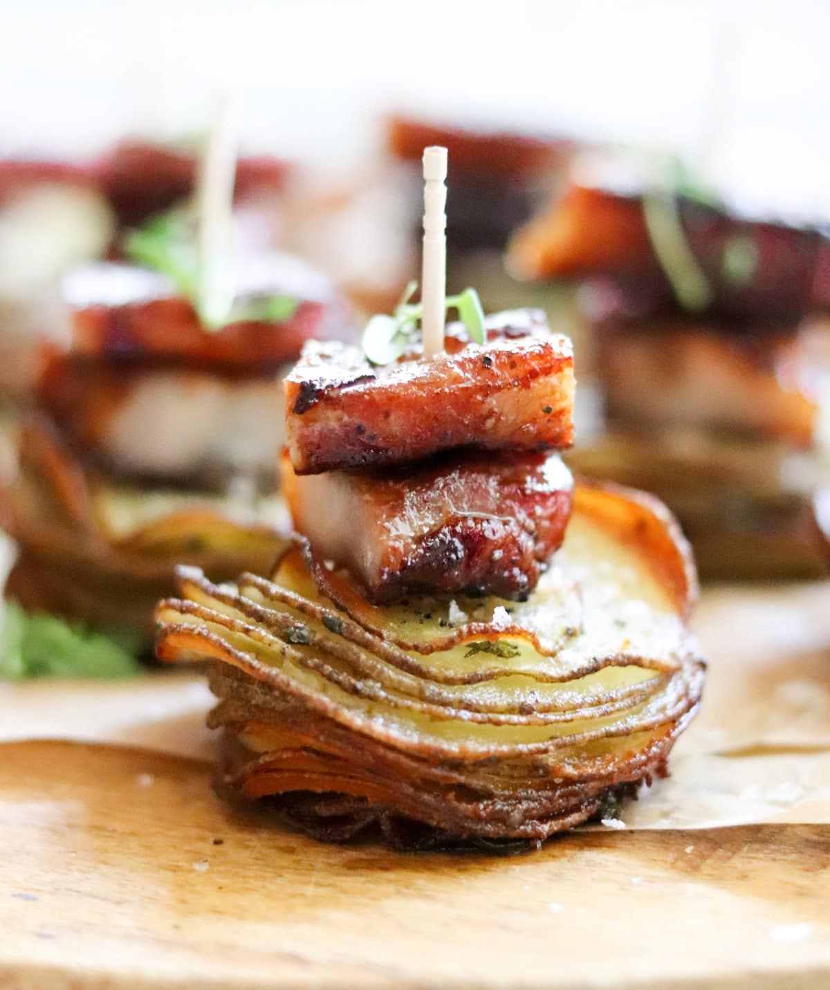 Pork belly mini with thinly sliced crispy potato skewer appetizer.