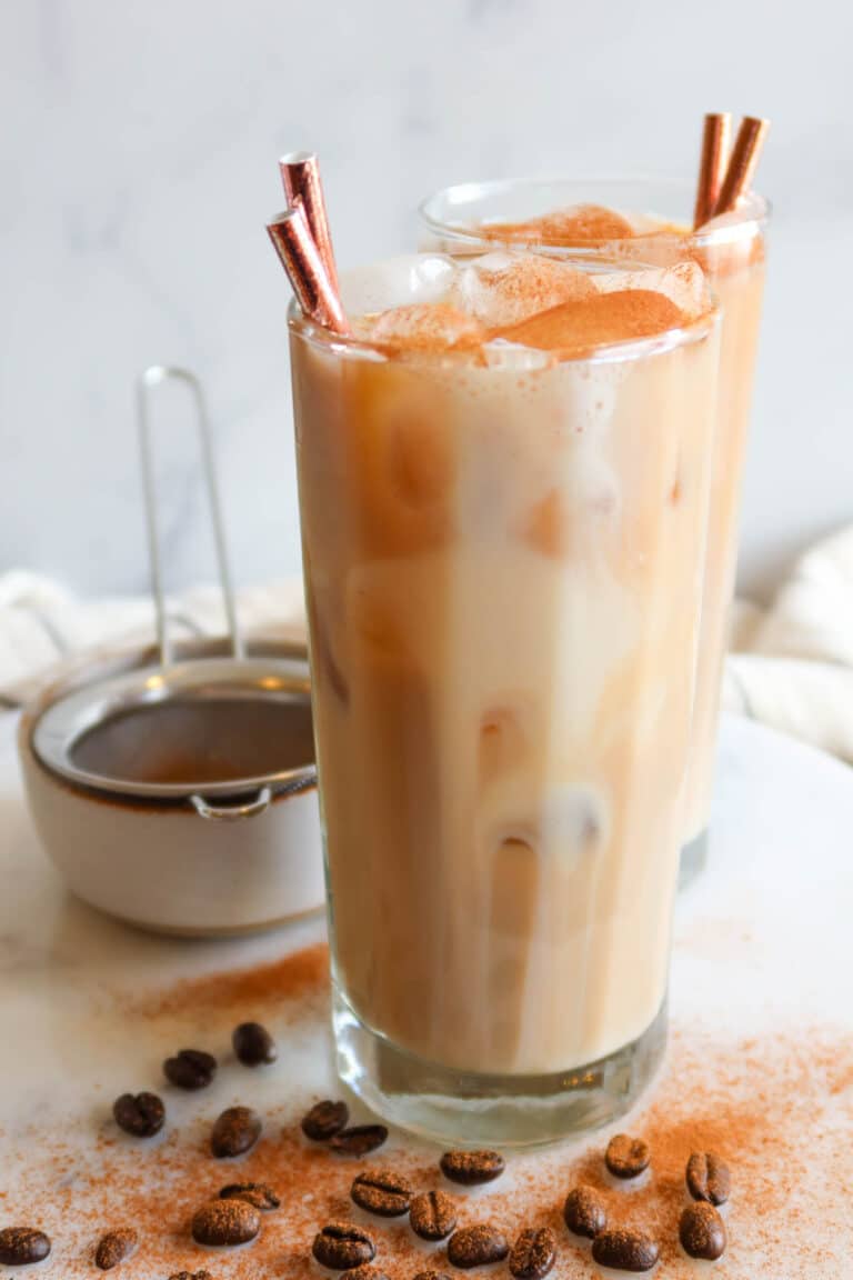 Protein coffee in glass with straws.