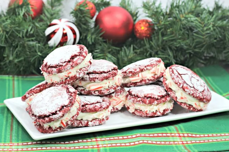 Platter of red velvet cookie sandwiches with peppermint frosting.