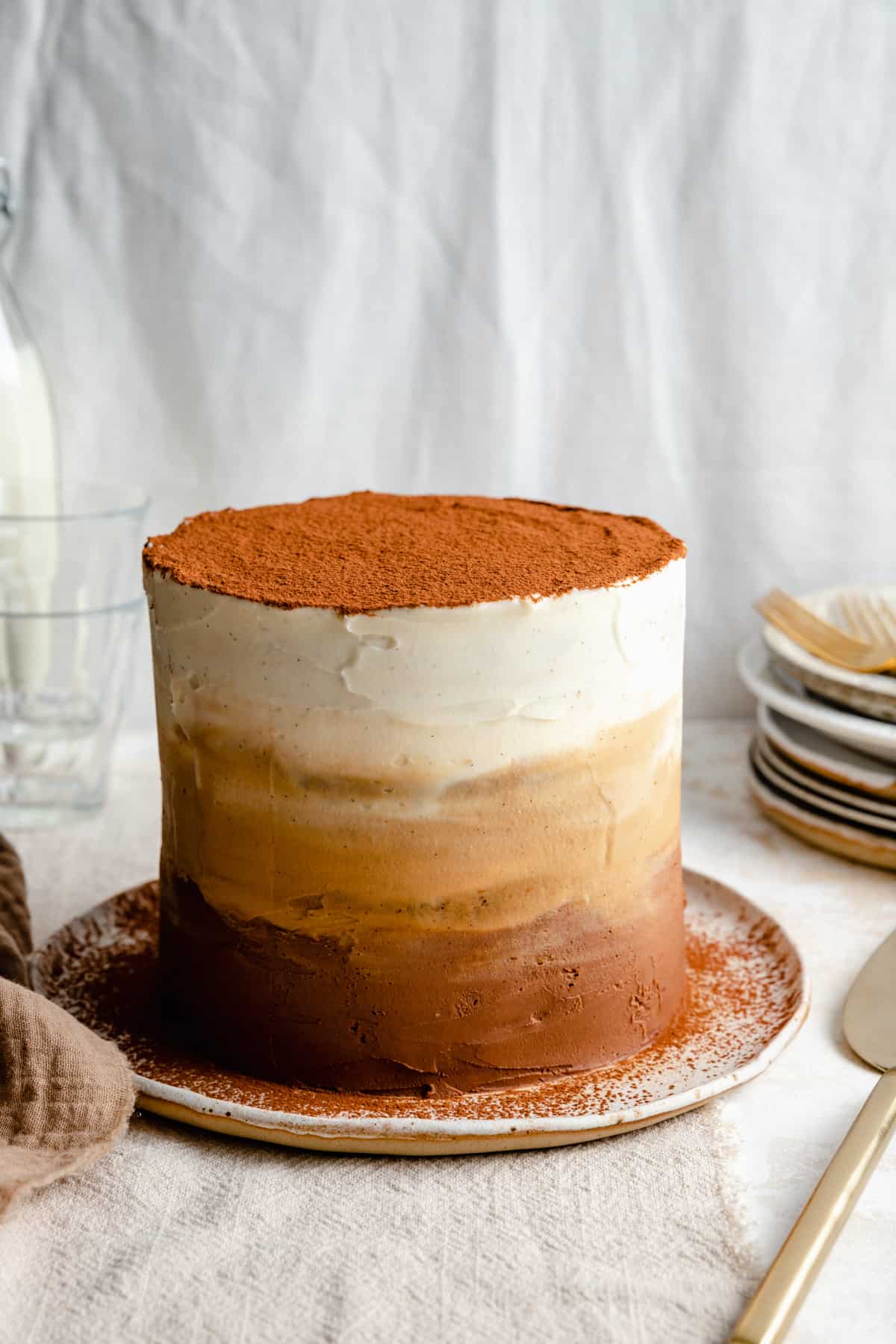 Ombre tiramisu cake on a plate.