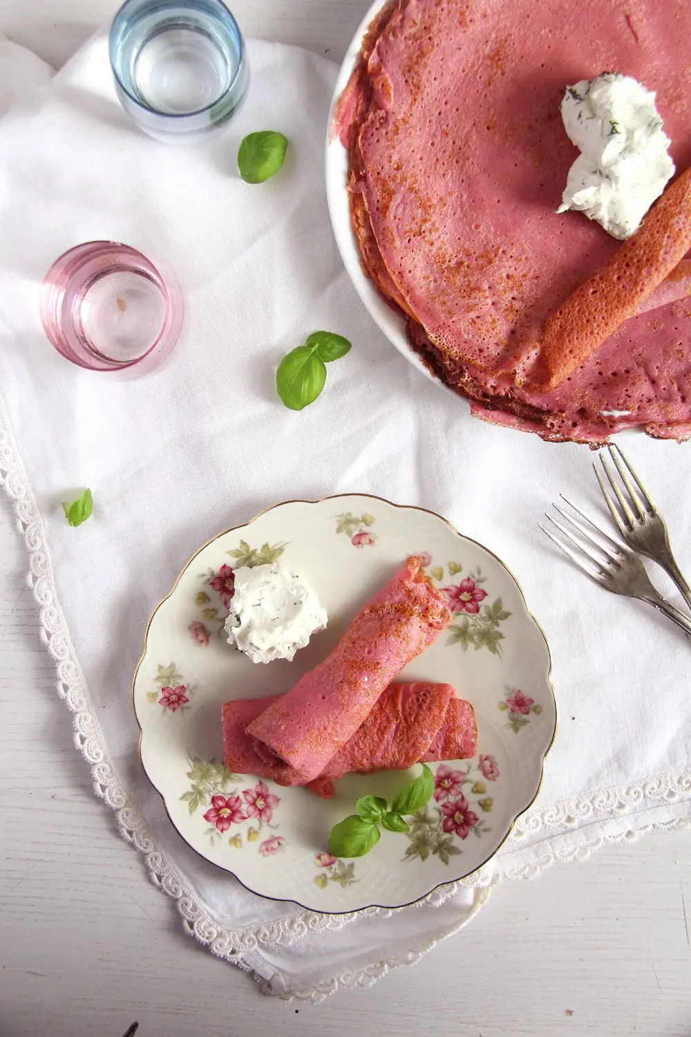 Pink beetroot crepes with savory dill filling.