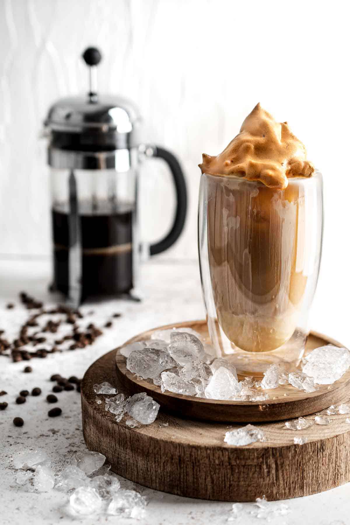 Iced coffee with condensed milk in a tall glass.