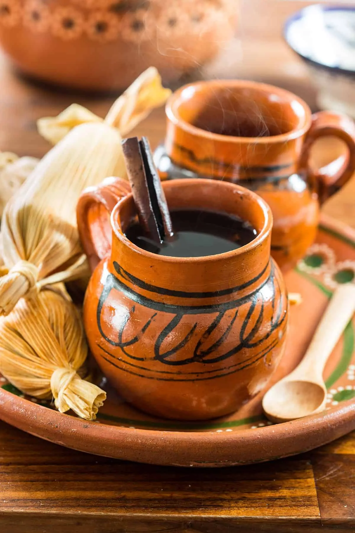 Mexican clay pot coffee in decorative Mexican mugs.