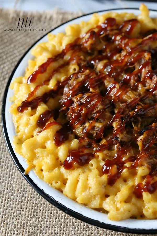 Pulled pork mac and cheese on a plate.