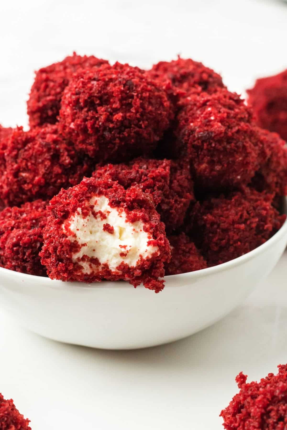 Cheesecake balls covered in red velvet cake crumbs.