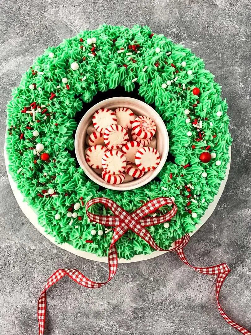 Red velvet wreath cake with peppermints in the center.