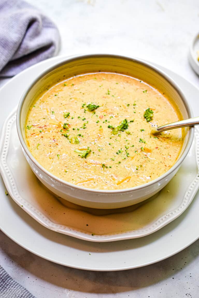 Roasted broccoli and cauliflower soup in a white ball.