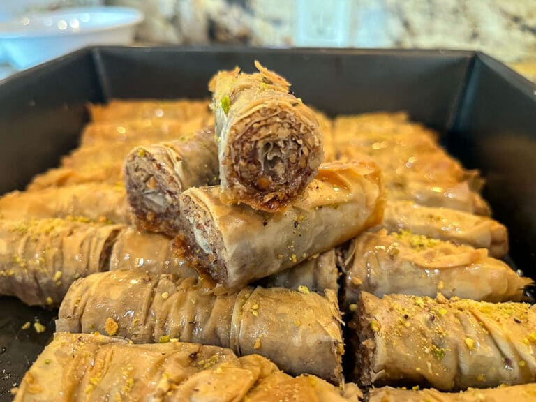 Baklava rolls in a pan.