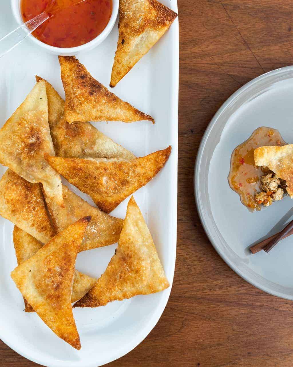 Tofu wontons on a white plate.