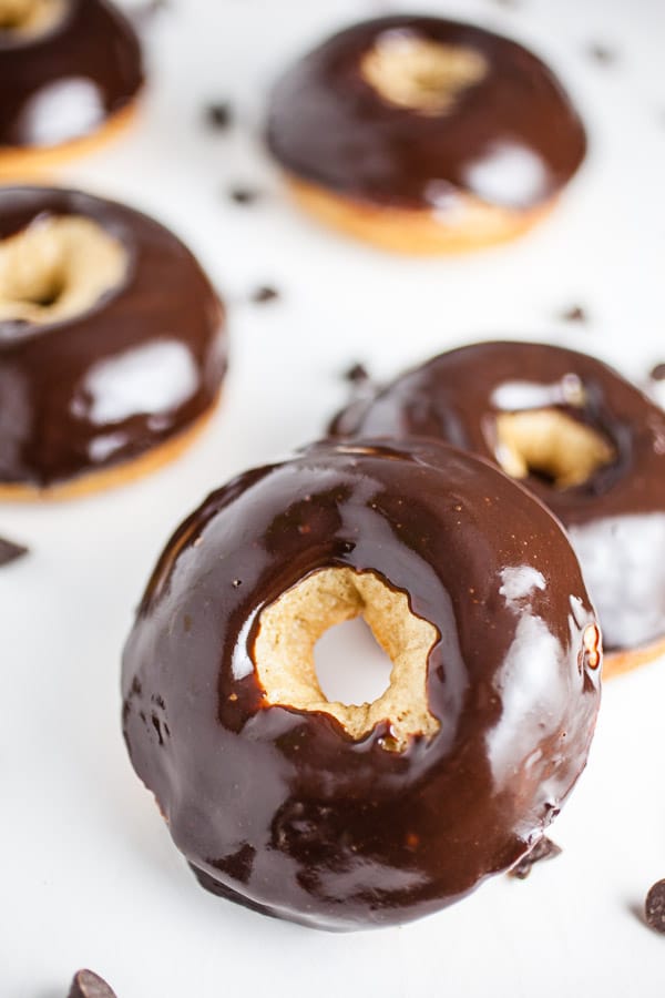 Bailey's donuts with chocolate glaze on a white background.