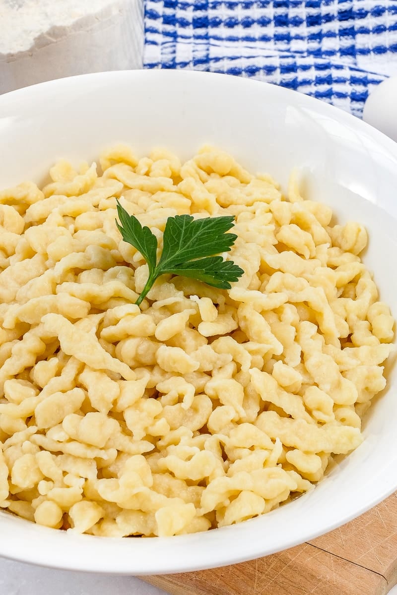 White bowl full of homemade spaetzle-German egg noodles.