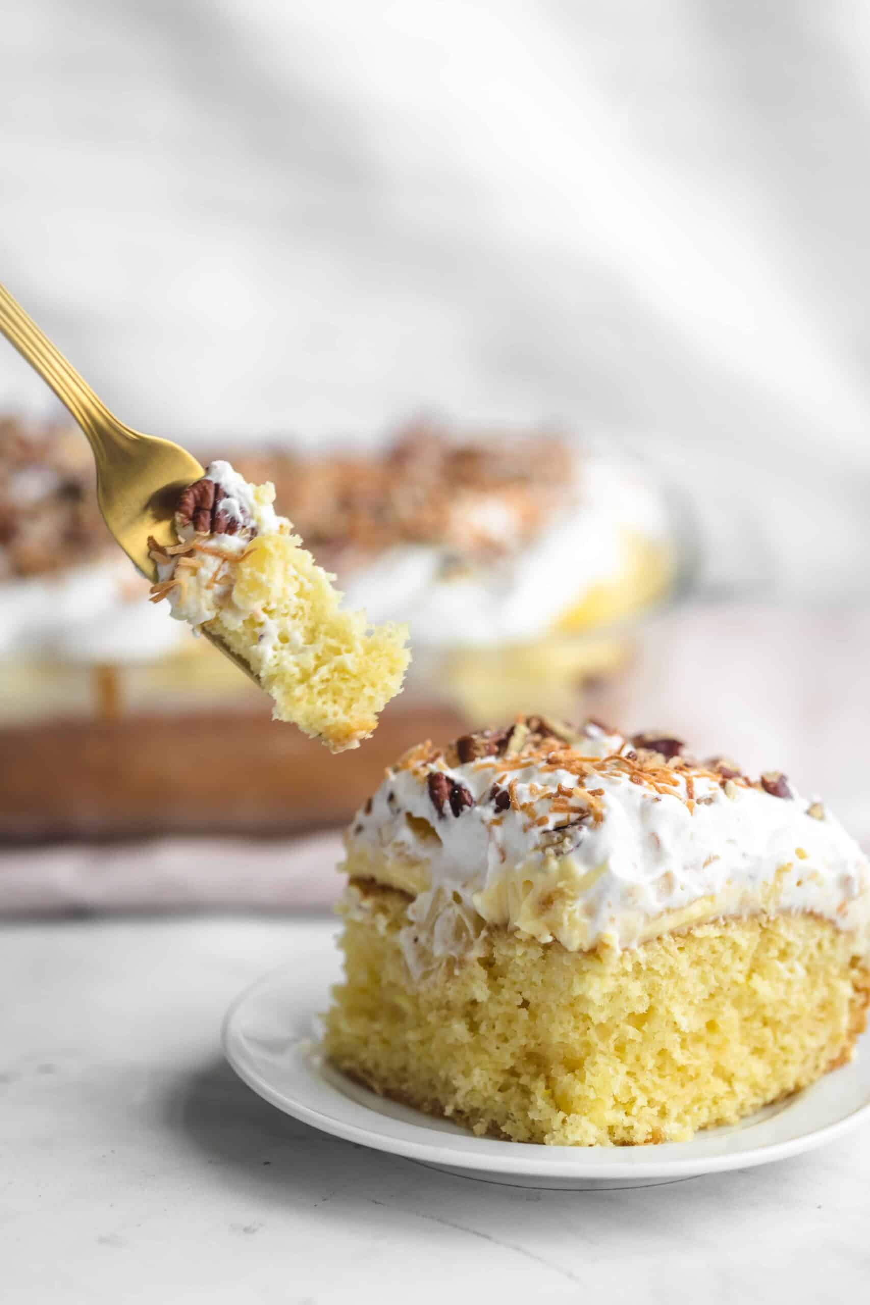 Fork full of pineapple pudding cake.