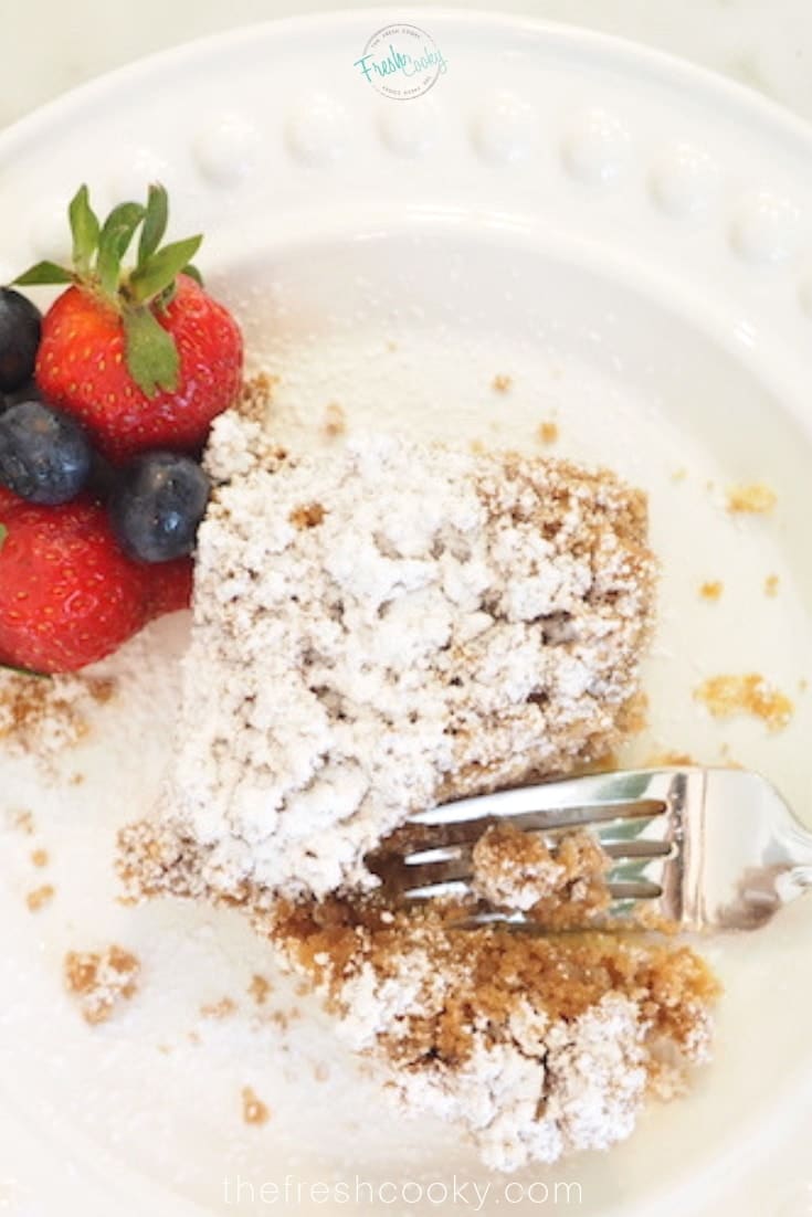 Starbucks copycat coffee cake with strawberry on white plate.